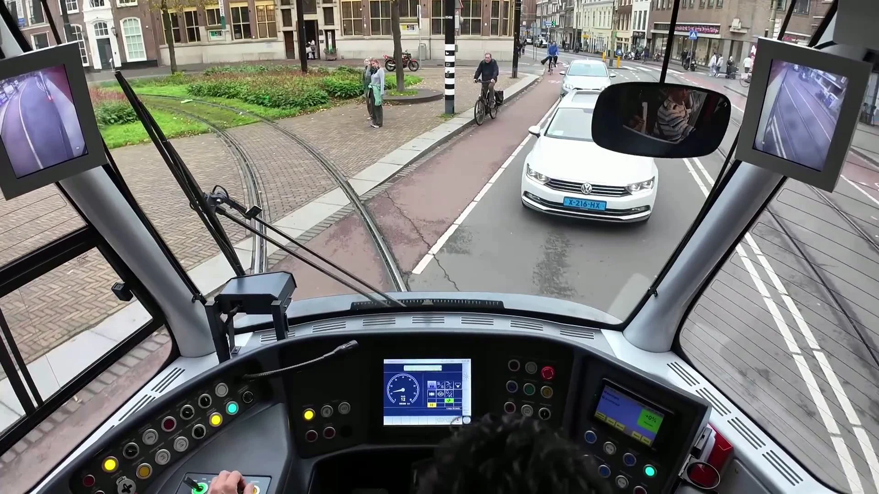 Forward-looking urban rail camera frame from operating rolling stock.