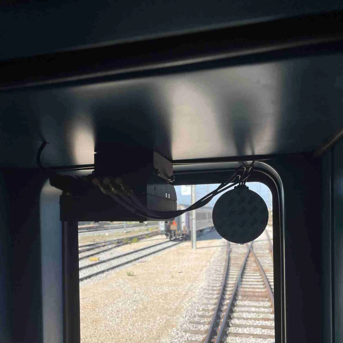RailEyes RailEdge camera capture layer shown with onboard railway inspection hardware context.