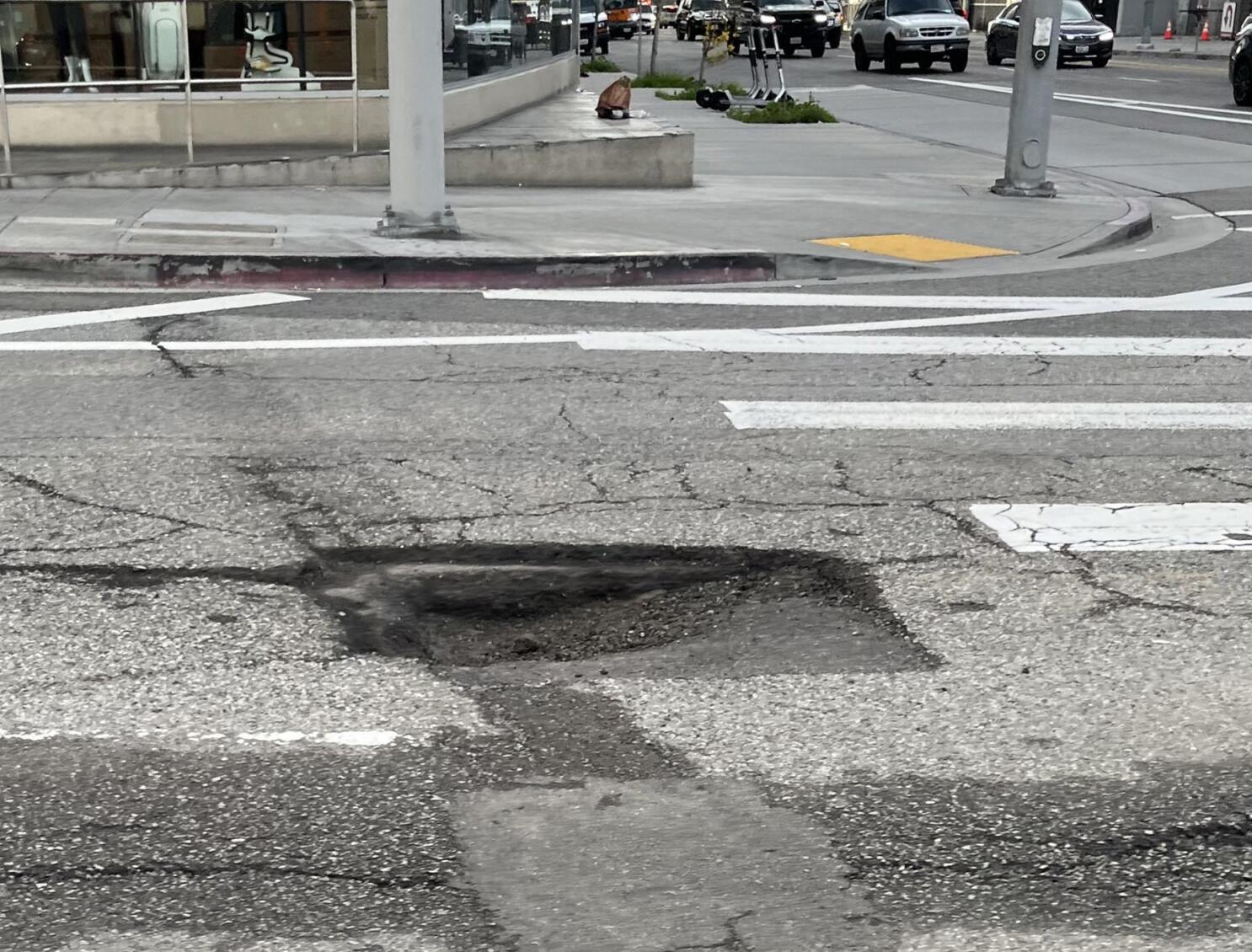 Pothole damage on an urban road — Urban Roads use case.